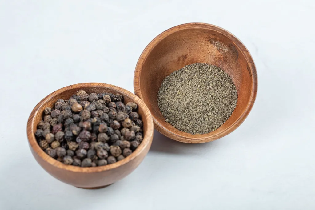bowls-grain-peppers-ground-pepper-white-surface.webp